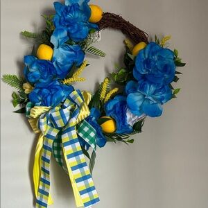 Vibrant Blue Floral Wreath with Lemons